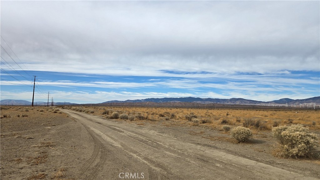 Great affordable Rosamond area parcel! 1.75 net acres with residential zoning, level topography and easy access fronting onto Holiday Ave with power lines at the street. Scenic views of the mountains, and energy development all around. A nice buy! *Buyer to make their own independent investigations regarding Zoning & General Plan Designations, Environmental & Hazard Zones, Access & Development Costs, Availability & Costs of Utilities.