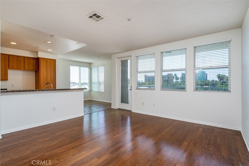 Enjoy the Spectacular Views of the Disneyland Fireworks!!!! This 3rd floor Luxury Condo in the exclusive Chapman Commons has 2 Bedrooms and 2 full Baths with Brand New Carpet and Paint. It boasts a beautiful open concept Living Room/Kitchen with granite counter tops, brand new appliances (never used) and plenty of cabinet space. The Large and Spacious living room opens up into a private balcony with perfect views of the Disneyland Fireworks. The laundry closet fits a stacked full-sized washer and dryer. The master bedroom has a large walk-in closet. This unit has two assigned parking spots (Ground Level) and a private caged storage area in the underground parking garage. The exclusive gated Chapman Commons community has plenty of guest parking, pool, spa, gym, poker room and banquet room. The building provides quiet water features, landscaping, and elevators. The grounds and common areas are very well maintained. Located near Disneyland, Downtown Disney, The Orange Outlets with quick access to freeways. Priced to sell this one will not last long!!!