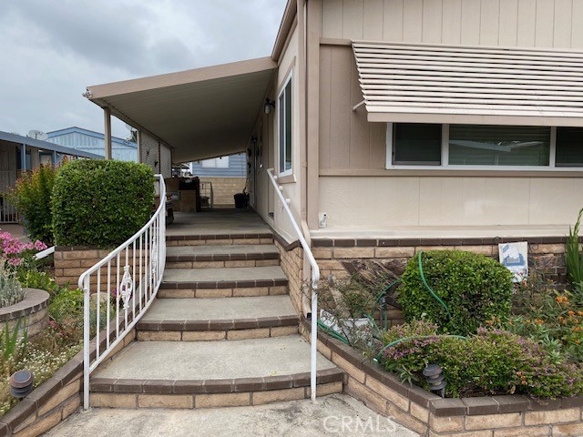 Huge Price Reduction from a Motivated Seller in Lake Park Brea - ** Dual Pane Windows, Copper plumbing, Updated Kitchen as well as both baths - The huge Living room connects with the Formal Dining room w/ Built-in Glass Front Hutch and Ceiling Fan/Light - The Large/Open Family Room with Ceiling Fan/Light is open to the Kitchen. Currently the Living, Dining, and Main bedroom each have newer Carpet - Kitchen is roomy with lots of Custom cabinets and counter space, upper cabinet Microwave Oven with vented exhaust, Pantry, and recessed lights - Master Bedroom has a Triple wide Closet, West facing window for plenty of natural light plus a Ceiling Fan/Light - Master Bath has been updated with vanity, fixtures, has a soaking tub, and two built in storage closets - Guest Bedroom is roomier than most in the Park and has wood/laminate flooring, ceiling fan & light, and a double closet - Guest bath has also been updated with a large EZ step-in shower, vanity, and fixtures - Large Laundry room w/ full Hookups and Storage cabinets - Enjoy outdoor living on the oversized covered patio with neighborhood views and cool breezes There is a tandem Two car Covered carport attached to the home for easy access and parking - Your Storage Shed is in your private Gated area - *Don't miss the opportunity to live in this Wonderful Senior Community - Enjoy your Lake Park Lifestyle with all it's events and activities for you to enjoy: Cards, Fishing, Exercise Classes, Pool, Billiards, Workout Room, Dinner Events, Bingo, Pickleball, Water aerobics, & more.