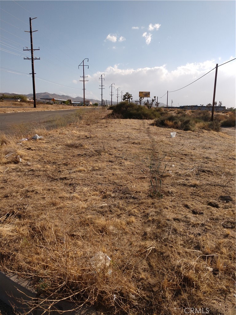 Investment Highly Visible.....Located in the Town of Yucca Valley,CA.Flat and buildable. Front hwy footage 267 sqft on hwy 62. side street Handford 261Sqft and back street 249 Sqft Corner Lot. Sewer/Water/ Power. The owners currently has a set of commercial retail store plans in the town Planning dept.