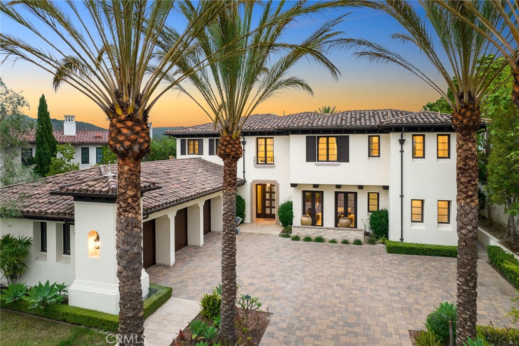 Located in the guard-gated Pelican Ridge community, a highly desirable neighborhood of Newport coast, this stunning Santa Barbara style estate features 7,945 sqft living space, 6 bedrooms, 9 bathrooms, presenting unobstructed canyon views and peek-a-boo ocean views. Behind the private gate, this recently updated custom home has a beautifully landscaped motor court with 3-car garage. The entrance presents a high ceiling embellished by a tasteful chandelier, and a sophisticated wrought-iron spiral staircase. New white oak wood flooring throughout the first floor. Two bedroom suites, home theater with full bath, wine cellar, living room with fireplace, formal dining room with french doors leading to serene side yard. Remodeled kitchen with marble countertop and new 6 burner Wolf stove, and dishwasher, beverage fridge and built-in refrigerator, From the picture window an abundant sunshine is brought in welcoming the family and guests. Breakfast nook has two side french doors to the yard. Spacious family room, private office/work room, powder room, laundry room complete the main floor. Upstairs, a master bedroom with a retreat offers sweeping views of canyon and coastal breeze. Master bathroom comes with separate sinks, vanity, expansive shower room, walk-in closet and tub. Enormous bonus room with half bath close to the master bedroom, can be a gym or 7th bedroom. Office with built-in desk and cabinets. Loft is good for gathering. Three guest suites with updated baths. Professionally designed yard with drought-tolerant landscaping, palm trees, putting green, 40 feet pool with spa, barbecue and water feature. Don’t miss your chance to enjoy the Southern California coastal living with world-class shopping centers, dining, beaches, golf courses nearby!