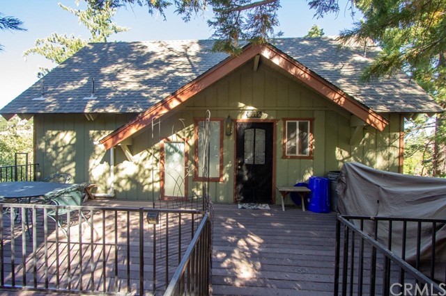 This house features Panoramic views of Golf Course lake area, the Desert, and the mountains. This charming 3 bedroom 2 bath house has engineered flooring on the main level which features an open floor plan with vaulted ceilings with rustic beams, a rock fireplace with a wood burning stove insert and a bathroom. The lower lever has 3 bedrooms and a full bathroom, the two other bedrooms have their own private deck. Large entry deck with plenty of room for entertaining needs. Come enjoy the beautiful views with trees all around the property. Property being sold AS-IS.