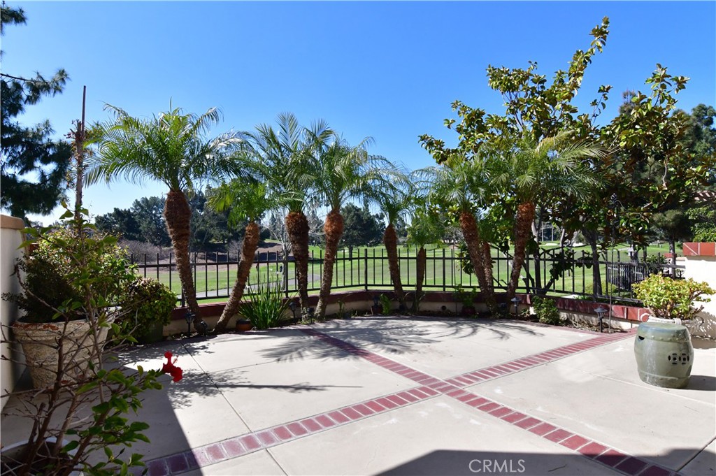 Experience stunning golf course views from this exquisite condominium. Positioned at a coveted corner spot with a private entrance and a 2-car attached checkered floor garage, this elegant abode has been recently repainted and furnished with new luxury vinyl flooring throughout. A warm and inviting fireplace in the living room, equipped with handsome TV cabinets, is a perfect spot for relaxing and unwinding after a long day. The spacious kitchen with new double pane window features a gorgeous granite countertop and seamlessly flows into the dining area and the living room, ideal for entertaining guests. The laundry room is conveniently situated downstairs by the garage. Upstairs, three bedrooms with new double pane window offer ample space for rest and relaxation. One of the guest bedrooms boasts unobstructed golf course views, while the master bedroom en suite is designed with a remodeled walk-in shower and double sinks, paired with a massive walk-in closet. The patio and yard offer exceptional opportunities to bask in the beauty of the golf course. This property is truly a paradise for any golf enthusiast.