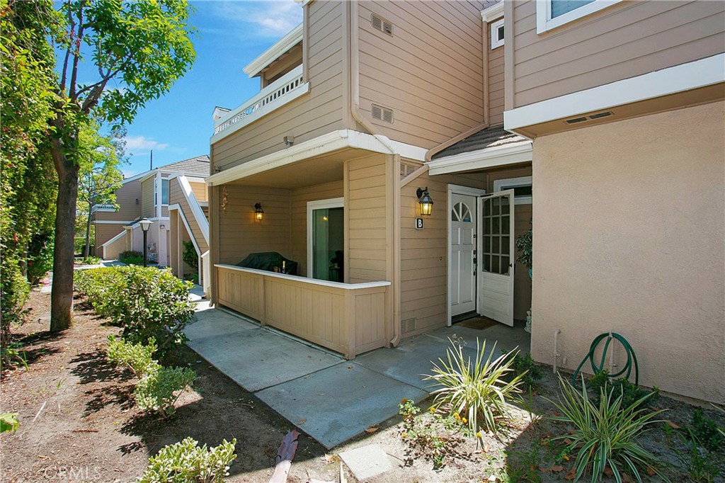 Welcome to the GUARD GATED community of Briar Oaks. This home sits perfectly within the community just steps to the community pool and spa and privately located with no one looking into your patio. As you enter into the front door you are greeted by the spacious living room that opens to the kitchen and dining area featuring glass sliding doors opening to the patio. Kitchen has newer granite counter tops, ample amount of storage & recessed lighting. Enjoy the breakfast bar off the kitchen as well as a formal dining area with it's own dry bar. Hall bathroom offers newer vanity, tile, mirrors and fixtures. Large master bedroom offers mirrored closet doors & its own ensuite bathroom. Master bathroom features a tub and shower, storage cabinets and newer vanity. Spacious secondary bedroom also features mirrored closet doors. Other features include; indoor laundry, direct garage access, A/C, laminate flooring, jetted tub, recessed lighting, newer interior doors and hardware, blinds, crown molding and baseboards. This community is a hidden gem that includes a swimming pool and spa and greenbelts throughout. Do not miss out on this amazing condo perfectly situated close to the 22, 405 and 91 freeways!