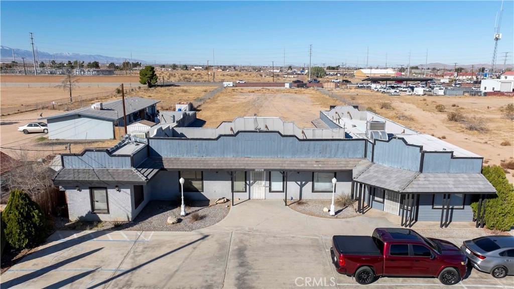 A prime opportunity awaits at 18026 Jonathan St., Adelanto, a versatile Business Park-zoned property, now available for sale or lease with flexible options. This 3,474-square-foot, single-story office building situated just over an acre offers individual suites ranging from 150 to 875 square feet or the option to lease the entire space. Designed for functionality, the property features a spacious courtyard, 19 parking spaces, a welcoming foyer, and two full-size bathrooms, making it an excellent fit for businesses of all sizes. Recent upgrades include air conditioning and a refreshed layout, ensuring a clean and professional environment. Zoned for Business Park use, the site allows for various commercial applications. For details on approved zoning and conditional uses, inquiries are welcome. Strategically located within five miles of the Southern California Logistics Airport, Adelanto Police Department, and the Adelanto Industrial Center Project, this property offers convenience and accessibility. The area is served by the Adelanto Elementary School District, providing access to nearby educational facilities. With its prime location and easy access to major highways, this property connects businesses to key industrial and commercial hubs. Whether you're looking to establish, expand, or relocate your business, this is an exceptional opportunity in Adelanto's growing business landscape.