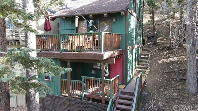 Searching for a serene cabin escape near Bear Mountain? You've found it! Enjoy relaxing in front of your high efficient wood-burning fireplace underneath beautiful vaulted ceilings with exposed beams. This recently remodeled 2 bed 1 bath home is centrally located within close proximity to the slopes, shopping center, and village. With the national forest just a few blocks away, this home is sitting among the trees. Embrace the mountain feeling of seclusion on your private deck perched above the wilderness. Add it to your list today!