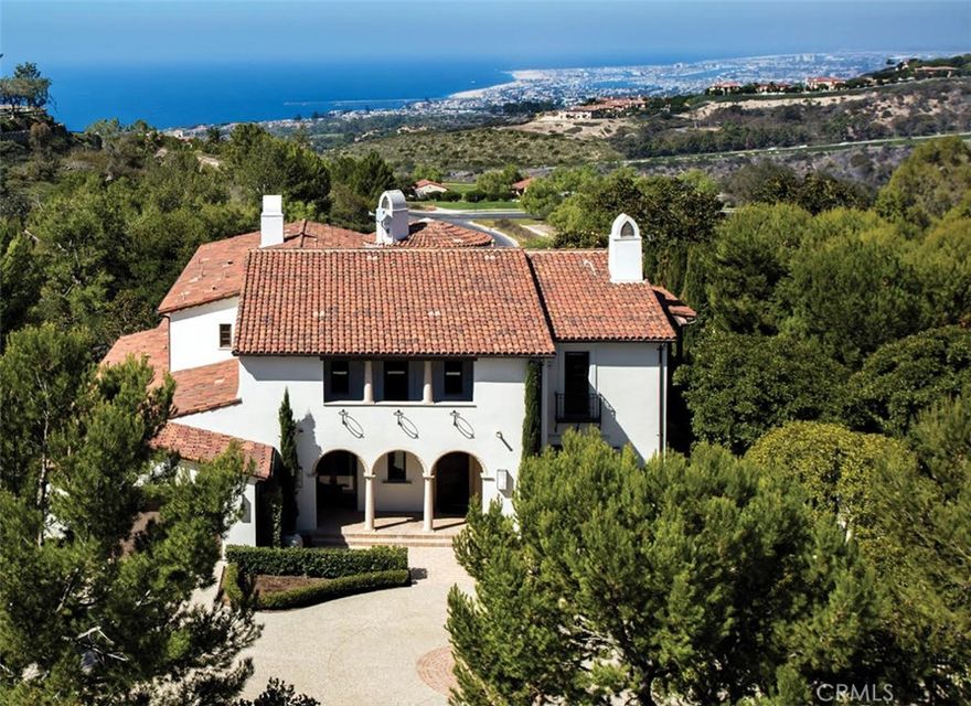 Representing the epitome of coastal luxury within the esteemed confines of Crystal Cove, Newport Coast. This distinguished residence, located within a gated and meticulously patrolled enclave, commands awe-inspiring panoramas of the California coastline from its exceedingly rare half-acre parcel, quietly nestled at the end of a tranquil cul-de-sac. Upon arrival, a private gated driveway gracefully unveils a motor court, setting the stage for the grandeur that lies beyond. Here, amidst the serenity of lush landscaping you are greeted by a residence of thoughtful sophistication and refinement. Showcasing the awe inspiring Pacific Ocean, its deep blue expanse stretching into the horizon, framed by the twinkling lights of Newport Harbor and reaching towards the silhouette of the Palos Verdes Peninsula. Catalina Island graces the vista, while the allure of year-round sunsets entertains nightly. Within this sanctuary, not one, but two kitchens, replete with premium appliances, including a Wolf range, double dishwashers, and twin built-in Miele coffee makers. This stately abode boasts four bedrooms, each a calm sanctuary with its own en-suite bath, alongside an additional powder room on the primary level. Ascend to the upper level to discover two secondary bedroom suites, each adorned with spacious walk-in closets, offering both privacy and comfort to guests complimented by a communal media lounge that could be reimagined into a potential 5th bedroom. For those inclined towards wellness and rejuvenation, a gym awaits seamlessly integrated into the master suite. Expansive and exquisitely appointed, the master retreat beckons with its own sitting area, two generous closets, and, of course, panoramic coastal views that serve as a constant reminder of the splendor that surrounds. Outdoors, an oasis unfolds, where the beauty of nature harmonizes with the artistry of design. A pool and jacuzzi beckon for moments of relaxation, while a sprawling lawn invites beneath the sun soaked southern California coastal climate. Exquisite hardscapes and meticulously curated landscaping further enhance the sense of privacy and tranquility, ensuring that every moment spent in this secluded haven is nothing short of extraordinary.