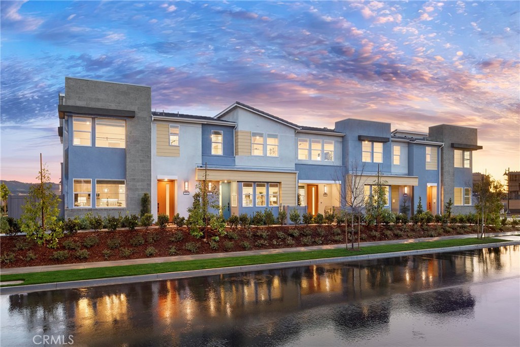 Set against a stunning backdrop of rolling hills, oak groves, and wide-open spaces is Willow, a one-of-a-kind enclave of modern, thoughtfully designed two-story attached townhomes surrounded by nature. Life’s different at Willow; after all, spending time in nature is good for the soul, with lowered stress and lifted spirits among the many benefits. And there’s nothing more serene and fulfilling than Rancho Mission Viejo’s “ranch life” – where you’ll enjoy endless open-air perks like trails, parks, community gardens, pools, playgrounds and more. Discover your best life surrounded by nature.
Welcome to Willow. Plan 1 Model at Willow at Rienda Village is a captivating fully upgrades two-story townhome offering 910 sq. ft. of living space with 1 bedrooms and 1.5 bathrooms. On the first floor, an impressive open-concept layout features a flex space, and modern kitchen Samsung appliances, including an electric range, microwave, refrigerator and dishwasher. The kitchen also includes Quartz countertops with full-height designer backsplash. A convenient powder room just off the kitchen completes the main floor. Upstairs, a luxurious primary bedroom connects to a spa-inspired bath with dual sinks and a spacious walk-in closet. An additional bedroom includes an ensuite bath and a walk-in closet. Additional features include welcoming 9 foot ceilings. Make plans to visit Willow at Rienda, it's a wonderful place to call home!