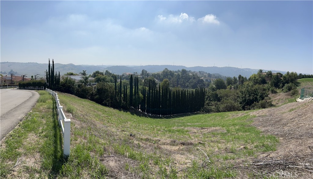 Discover the epitome of California living on this exquisite residential vacant land nestled within the prestigious 24-hour guard-gated community of Diamond Bar. This exceptional property offers the perfect canvas for your dream home, boasting breathtaking panoramic mountain views that will leave you in awe. Situated in the heart of Diamond Bar, this land parcel spans in an idyllic location, offering not just a place to build a home, but an opportunity to create a lifestyle. The natural beauty of the surrounding landscape, with its rolling hills and lush greenery, sets the stage for a tranquil and serene living experience. The 24-hour guard-gated community ensures unparalleled security and peace of mind, allowing you to fully embrace the joys of life in this exclusive enclave. Imagine waking up to the warm California sun casting a golden hue on the nearby San Gabriel Mountains and retiring to your private oasis, far removed from the hustle and bustle of the city. With a generous land size, you have the freedom to design and build your dream home, complete with all the amenities and features you desire. Whether you envision a contemporary masterpiece, a charming Mediterranean villa, or a classic California ranch, this blank canvas awaits your vision.
Located in Diamond Bar, you'll enjoy convenient access to top-rated schools, world-class shopping and dining, and a thriving community. This vacant land is more than just a piece of real estate; it's an invitation to craft the life you've always dreamed of, surrounded by natural beauty and the comfort of a secure, gated community. Opportunities like this are rare, so seize the chance to own this beautiful residential vacant land with breathtaking mountain views in Diamond Bar, California, and turn your vision of luxurious California living into reality. Your dream home starts here.