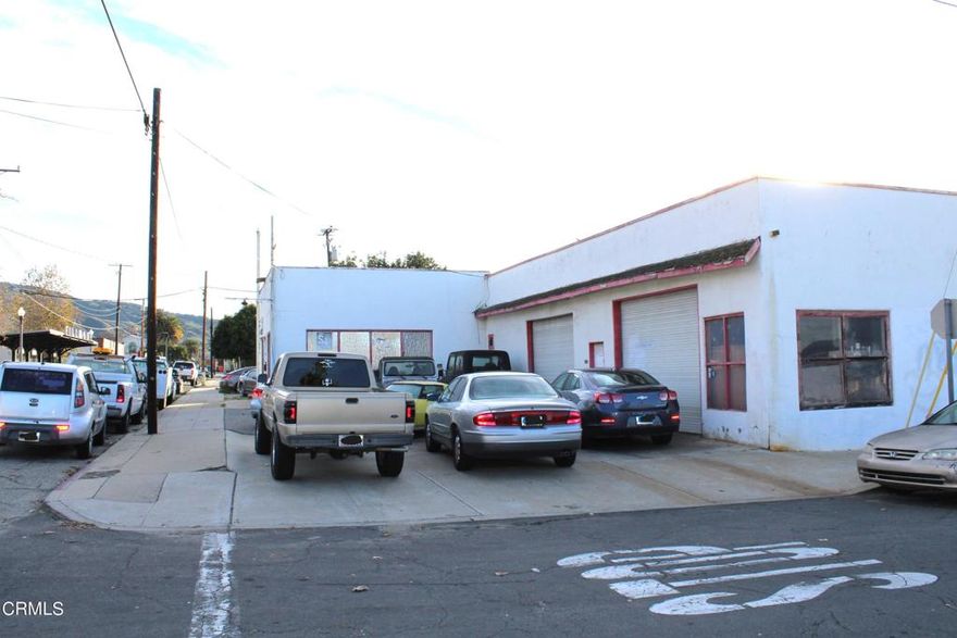 Shop building with attached storefront just two blocks from Central Avenue in Downtown Fillmore. 4,072 SF building on a large 21,390 SF lot, nearly 1/2 acre of commercially zoned property. Long time tenant is on a month to month basis, but will need time to move out if asked to do so. Several large doors for vehicle access to the shop with the storefront being utilized for retail use in the past. Large yard area surrounds the building for extended use. This could be a very functional property with a few upgrades.