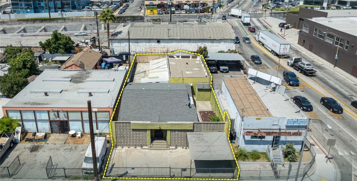 We are pleased to present a versatile industrial property in Huntington Park, California, which offers an owner-user or investor a tranquil office environment, an expansive workshop, and a fenced yard with storage and private alley access. The property includes three structures totaling approximately 2,827 square feet, situated on ±6,912 square feet of land. The office structure, measuring around 1,300 square feet, can serve as a creative workspace, administrative offices, or storage area. This building leads into the second and third structures, which offer over 1,500 square feet of open warehouse space, manufacturing areas, and covered storage. The third structure, approximately 400 square feet, was likely a garage at one point and is therefore not fully accounted for in some public records.
The property features a fully fenced, partially covered outdoor yard space, with the convenience of a gated alley used by only two parties—the owner of the subject property and one neighbor. The property is zoned Manufacturing Planned Development (MPD), a Huntington Park-specific industrial with many commercial uses allowed as well.
This offering is unique in that it provides both a presentable office space and an expansive workshop and yard, complemented by well-maintained surroundings, manicured landscaping, a tranquil monotone paint scheme, and mid-century modern design elements that make this industrial building both versatile and stylish for nearly any business.