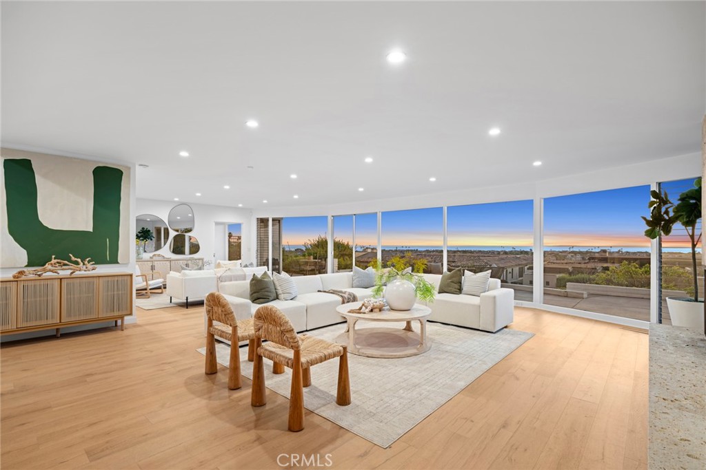 Jaw dropping ocean, bay, and Catalina Island views, framed by impressive floor-to-ceiling windows and doors that capture the stunning scenery. Discover this newly remodeled & highly sought after single level, 5-bedroom plus pool gem, on the single loaded street of Sabrina Terrace in Corona Del Mar's exclusive Irvine Terrace neighborhood! Situated on an expansive 11,200+ sqft lot, this home offers Carefully renovated to maintain its mid-century modern appeal, the home features high-end updates, including new bi-fold doors, a Thermador stove, white oak flooring, fully remodeled baths, custom cabinetry, and thoughtfully refreshed interiors with an open floor plan. Two of the five bedrooms, along with the luxurious primary bath and custom his-and-hers closet, offer breathtaking views. Three sets of large bi-fold doors open the space to a private courtyard with a large pool and a separate entrance pool house. Relax on the spacious back patio, ideal for enjoying the serene surroundings. This location provides easy access to Corona del Mar Village, renowned dining, upscale shopping at Fashion Island, the Yacht Club, Corona del Mar State Beach, and Irvine Terrace Park. *Please note: Home is leased and tenant-occupied through 1/31/2026 at a monthly rental rate of $27,500. An excellent opportunity that allows prospective buyers time to develop their plans while the tenant remains in place.