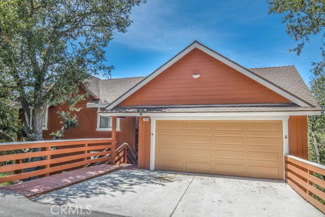 Cathedral Ceilings. Panoramic views. Bedroom and bath on entry level Large Family Room or could be 4th bedroom. Great ambiance. Hot tub. Sunset and Forest Views! Level entry into a 2 car garage as well. Year round plowed road. Lake Rights. Good vacation rental history.