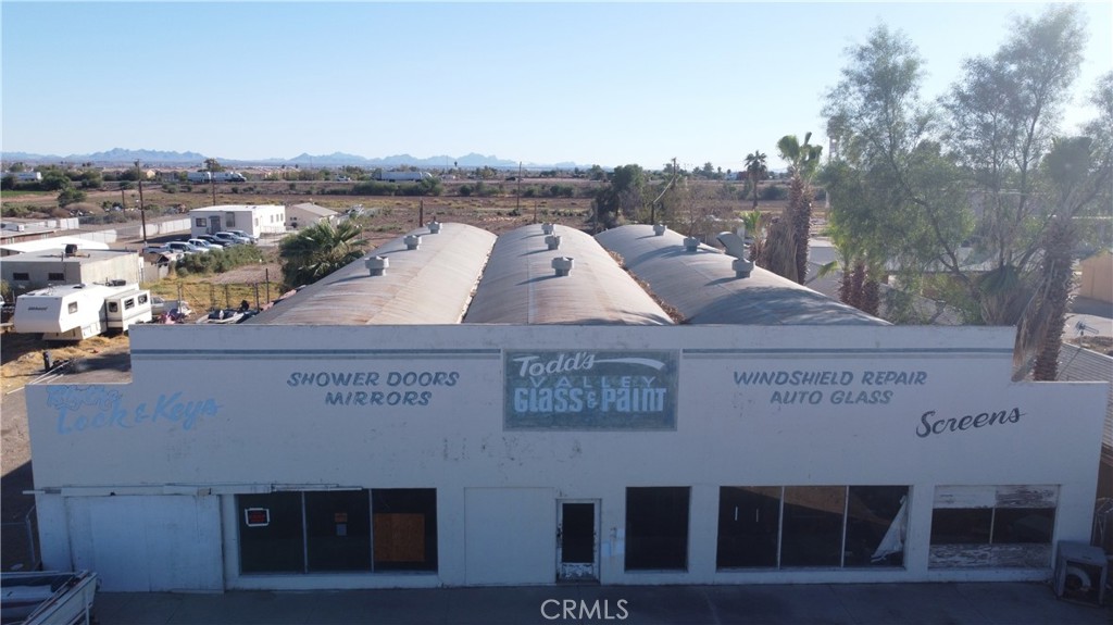 Discover an incredible investment opportunity with this expansive commercial building, boasting a generous 12,420 square feet of versatile space. Situated on a prime 2.11-acre parcel, this property features large open industrial areas and multiple office spaces, making it perfect for a variety of business ventures. Located on the busiest street in town, it enjoys high visibility and foot traffic, with the added advantage of being right next to one of the only grocery stores in town. The fully fenced property provides added security and potential for future development, whether you’re looking to expand with additional storage or explore other investment opportunities. Don’t miss your chance to make this strategic location the foundation for your business success!