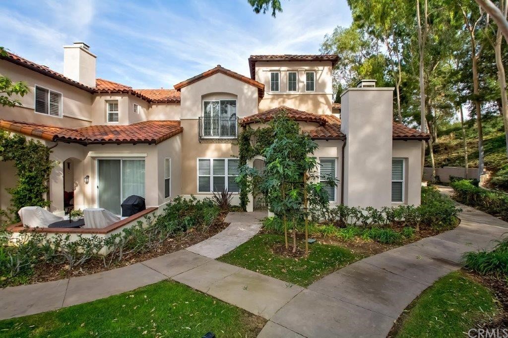 11 SORRENTO COURT IS A SOPHISTICATED 2 STORY CORNER TOWNHOUSE in beautiful, award winning, gated Trovare in Newport Coast: This townhouse has a stunning kitchen with designer cabinets, granite counters and a full compliment of top of the line stainless appliances. Downstairs is comprised of a living room with a fireplace, lots of windows and light, high vaulted ceilings, and slider entrance to a large outdoor patio, family room adjacent to the kitchen, a bedroom, bath, laundry room with washer and dryer and direct access to the 2 car garage . Up the dramatic spiral staircase are 2 additional bedrooms and bathrooms. The stairs and second level of this home have brand new carpet. Premium corner location overlooking lushly landscaped greenbelt. Plenty of sun-filled windows provide a light and bright living space. Enjoy resort living with full amenities: private gated community of Trovare with pool and spa as well as exclusive membership in Coastal Canyon Recreational Center with Jr. Olympic salt-water pool, tennis and sport courts, staffed clubhouse and community center with bbq's and kitchen. Close proximity to Crystal Cove Beach, Pelican Hill Resort 5 star international golf course and spa. Nearby Fashion Island and Crystal Cove world-class shopping and dining. Minutes to airport, schools, 73 Hwy and beach.