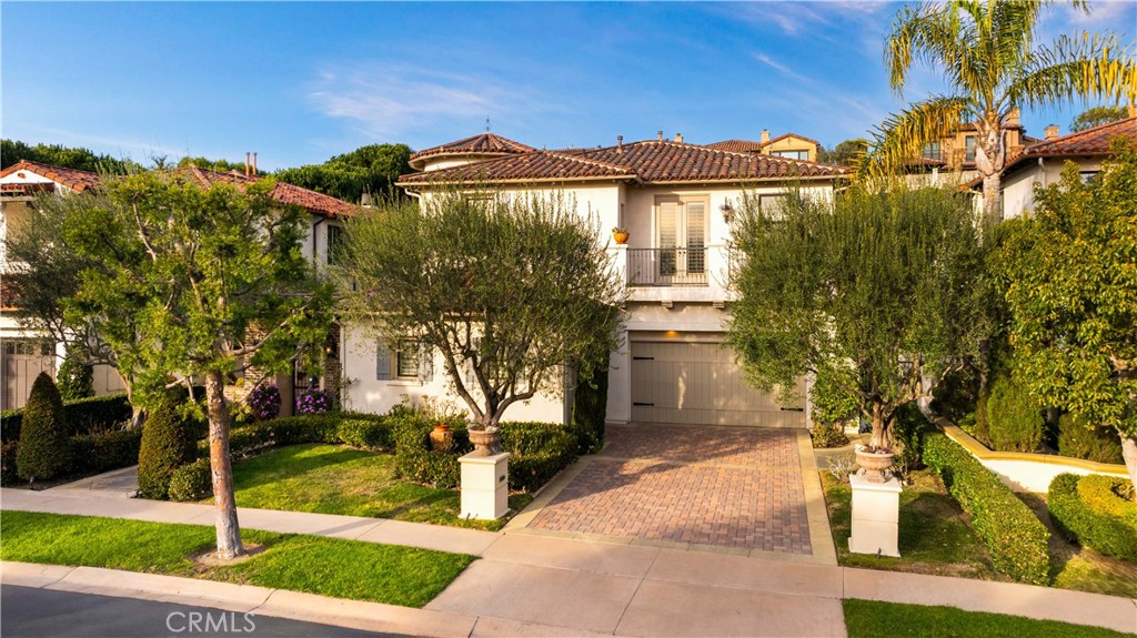 Welcome to 15 Venezia, an exquisite Mediterranean inspired home within the exclusive guard gated community of Coastal Canyon. This meticulously crafted 4 bedrooms, 4.5 bathroom + office + bonus room . The resort-style living made up of lush professionally landscaped grounds backing to a hillside, cascading water fountains and absolutely stunning gazebo and fireplace.Upon entry, guests are immediately greeted with soaring ceiling heights in the grand foyer that leads to the office and double-high ceiling formal living room, formal dining room, family room, and dream chefs kitchen. The gourmet kitchen overlooking the water fountain features Viking stainless steel appliances, a central island and walk-in pantry.A main floor guest suite provides an ideal retreat for guests and family, while the upstairs hosts another two en-suite secondary bedrooms, bonus room, and an elegantly Master bedroom with a separate setting room, master spa style bathroom and custom master walk-in closet .Miles of beaches are just down the hill, and regional and community parks, award-winning schools, Fashion Island, Newport Harbor, Crystal Cove, Pelican Hill, Corona del Mar and Laguna Beach are minutes from home.