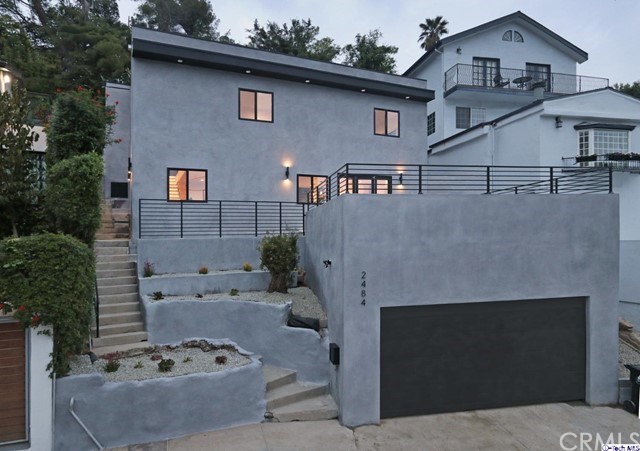 Get ready to fall in love with this gorgeous Beachwood Canyon modern stunner! Drenched in natural cheerful sunlight, This 3 bed 2 bath gem features an open flowing floor plan and spacious bedrooms, each with their own walk-in closet! The chic designer quality full bathrooms feature glass showers, custom tile work, and smart mirrors. Beautiful wood floors blend flawlessly with thoughtful high quality, custom designed finishes. Truly a Hollywood entertainer's dream, the brand new chef's kitchen features state-of-art stainless steel appliances and overlooks the open concept great room. The large accordion doors open up completely to reveal an expansive deck overlooking the vibrant treetops of the Hollywood Hills. Spend your Saturday mornings hiking the many trails within a stones throw, and grab lunch with your friends at innumerable local cafes and restaurants. When the evening arrives you're only a quick drive from the bustling nightlife Hollywood has to offer. This is the one!