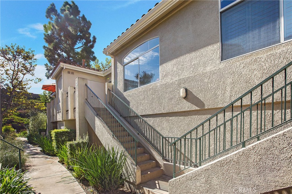 Location is Everything!!! A Cozy one bedroom that is ready for its new owners. This home has had only one owner and is ready for its new chapter. The condo is just minutes away from Laguna Beach and the toll roads. You enter into a light and bright space with new Vinyl flooring and cathedral ceilings. The kitchen has new stainless steel appliances and the entire condo has been freshly painted. The bedroom has two closets and is connected to the vanity with skylight. You have a spacious patio deck that leads you to the closets for your full size washer and dryer. This home has no one below you and no one above you. The garage is located just steps away with your own entry door. This is an added convenience and a premium for this community. This community was recently re-piped and tented. There is plenty of visitor parking right outside your window. The community has two pools, gym and many things to offer. Welcome Home!!!