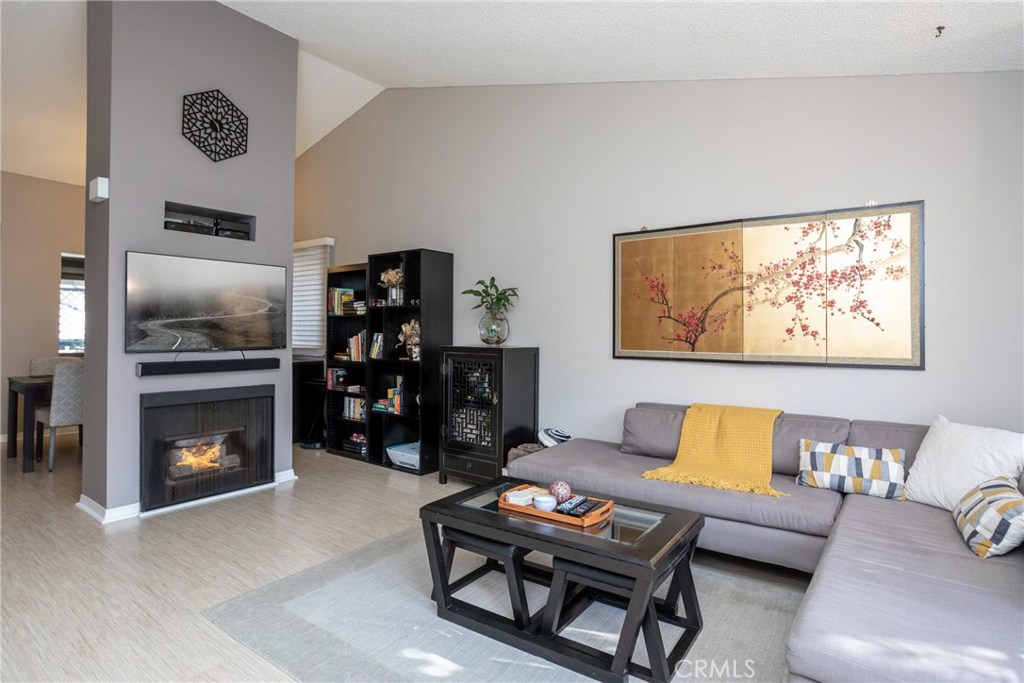 Great opportunity to purchase a starter home or an investment property in a nice serene neighborhood in west Anaheim. This is an upper end-unit with vaulted high ceilings and an open layout that has a great flow from the kitchen to the living room. The property shares one wall and has a detached 2 car garage. It has a separate laundry area on the patio near the kitchen, owners recently put in a brand new A/C and dishwasher, and has a gas fireplace in the living room. The home is located in a quiet community near a park, conveniently located near shops and restaurants, and has great upkeep and landscaping throughout the community. HOA covers water, trash & sewer, and the community spa. This is definitely an opportunity that will not last in the current market!