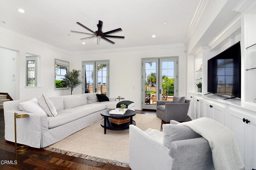 Experience luxurious waterfront living in this exquisite 4-bedroom, 3-bathroom home nestled within the prestigious gated community of Seabridge in the Channel Islands harbor with a 24-hour guard.This home epitomizes coastal elegance with every detail meticulously upgraded and adorned with decorator touches. Spanning across two levels, the main floor welcomes you with an open layout designed for seamless entertaining. Revel in the gourmet kitchen featuring an 8-burner stove, stainless steel appliances, dual dishwashers, a spacious granite countertop, and elegant light cabinets. Custom-built wall units, gleaming hardwood floors, and bespoke window treatments adorn the space, exuding sophistication. In addition, the home is loaded with the newest 'smart' devices including lighting, blinds, sprinklers, door locks, thermostats, smart speakers and even a robot vacuum cleaner. For example, lighting in rooms can be 'turned-on' by a simple voice command (e.g., to turn on the kitchen lights just say 'Echo turn on kitchen lights'). The three-car garage even has an electric charger for your car and an additional refrigerator/freezer, which is perfect for entertaining.Step outside to discover an inviting outdoor patio complete with French doors, a gourmet kitchen, perfect for hosting summer barbecues while enjoying the serene waterfront views. Your private 35' dock awaits just beyond, offering effortless access to the tranquil waters of the harbor (for an additional fee, if available). Retreat upstairs to the opulent Master Suite, boasting a spectacular Master Bath adorned with lavish tilework and a large jacuzzi tub--ideal for unwinding after a long day.Two additional bedrooms upstairs, one of which offers captivating water views, share a lavishly appointed bathroom. Additionally, there's a downstairs bedroom that provides flexibility and convenience. Indulge in the coveted harbor lifestyle, where endless walking paths, acclaimed restaurants, and the allure of island adventures await just moments from your doorstep.Residents of Seabridge also enjoy exclusive access to the Clubhouse, Fitness Center, Pool, and Spa, completing this unparalleled coastal living experience within walking distance of the beach. Adding to the eco-friendly allure, the home comes equipped with an owned Tesla solar system to power the whole house, ensuring sustainability and energy efficiency. Nestled halfway between Malibu and Santa Barbara is where you will find this gem