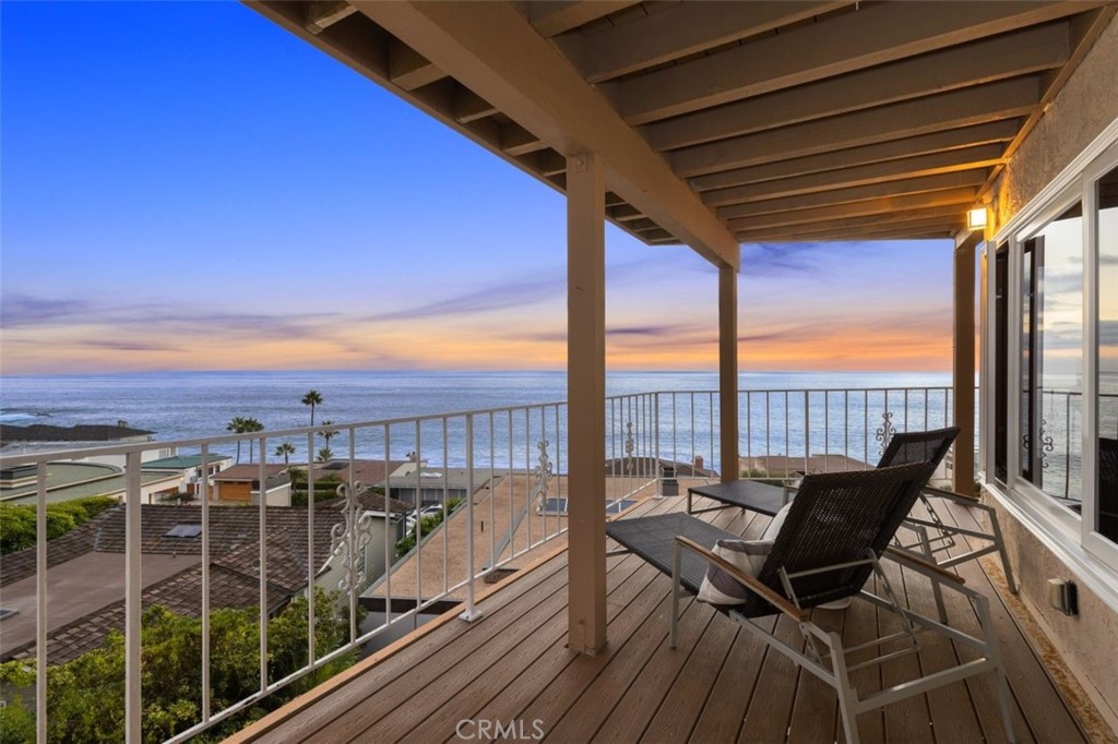 Rare opportunity to purchase along the Laguna Beach coastline in the prestigious community of Lagunita. With three levels of panoramic, white water ocean views only steps to the surf and sand, this home captures the essence of a beach retreat that has an impeccable layout flowing seamlessly for daily living. The moment you enter your eyes will be drawn to the spectacular view across the main living and dining room, out the wall to wall glass patio doors to the endless ocean and sky. To your right is the large kitchen with granite countertops, and to your left the main level master suite and spa bath. Downstairs are three additional bedrooms each with their own inviting ocean view decks. This residence offers approximately 3,779 sq ft of living space, and has a generous backyard to create another refuge. The lowest level has been uniquely separated to allow for separate living or a guest suite. This home is positioned perfectly on the lot to capitalize on the view while being out of direct sunlight the majority of the day! Watch the whales migrate as you cozy up by the fireplace, or take a quick dip in the water with your private access to Victoria Beach, just steps from the home. Fall asleep to the sound of waves breaking on the shore, and rise as a bird in flight as the pelicans fly by with your morning cup of coffee. This private coastal home comes with security gate access and a patrolling guard. Neighboring the world class Montage Resort and Spa.