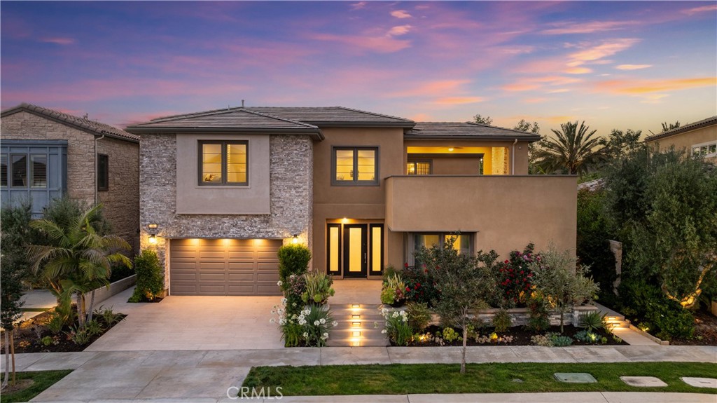 Welcome to the crown jewel of Altair, Irvine – a rare opportunity to own a magnificent property situated on a generous 10,516 sqft lot, featuring a striking Serene trees and breathtaking hillside views. This luxurious Lumiere Plan 3 residence is the largest home in the entire community, making it one-of-a-kind and an opportunity that you rarely find. Located within a prestigious 24-hour guard-gated enclave, it ensures peace of mind and exclusivity. Spanning 6,860 sq ft, this home includes 5 bedroom suites, a powder room and a fully renovated lower level. The open floor plan is highlighted by high ceilings, upgraded white cabinetry,and exquisite wood flooring and tiles. The gourmet kitchen is a chef's dream, featuring a large island that seats at least 10, a built-in refrigerator and wine cooler,ample cabinetry extending to the ceiling, stainless steel appliances with a six-burner stove, a large walk-in pantry, and an elegant chandelier. Spacious living is equipped with fireplace. The private oasis backyard is a standout feature, offering a pool, spa, mature trees, and a see-through glass wall that seamlessly brings nature indoors. This backyard provides unparalleled privacy, with no neighboring houses in sight, so you feel like you own the whole neighborhood. Additionally, the built-in BBQ with covered decking offers an amazing opportunity for luxurious outdoor living and entertaining. This home includes a spacious NEXT-GEN suite with its own entry, retreat room, bedroom suite with on-site laundry, and a private bathroom – perfect for guests or extended family. Upstairs, the bright and spacious bonus room provides access to a huge private deck, ideal for relaxation or entertainment. The loft is partially converted into a sixth bedroom, while the well-appointed master suite features a custom walk-in closet and a spa-like bathroom with dual vanities, a standalone soaking tub, a luxe glass-enclosed shower,and lavish tile decor. Two additional bedrooms upstairs each have their own upgraded bathrooms, ensuring comfort and privacy for all. The lower level is designed for entertainment and family gatherings, with a built-in wet bar, a gym room, partial open space with separate backyard access, and a spacious full bedroom suite.Residents enjoy five-star resort-style community pools and trails within the Altair community. The home is located in the esteemed Irvine School District and offers easy access to I-5, I-133, and nearby shopping malls.