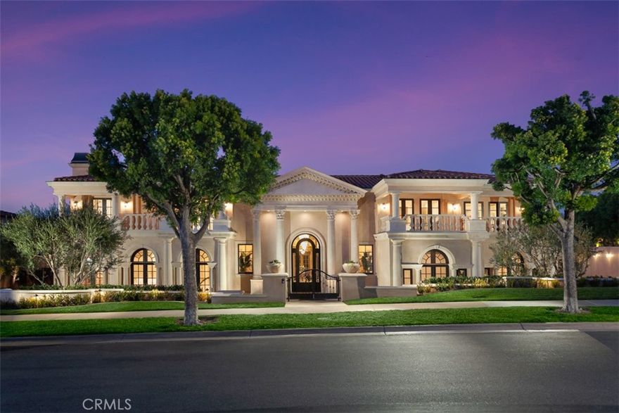 Situated behind the prestigious guard gated community of Pelican Crest on a 100’+ wide lot to maximize its dramatic curb appeal & breathtaking views, 21 Skyridge has spared no detail in its recent renovation. Every facet of the home has been carefully reimagined with the finest materials while maintaining the timeless qualities found throughout. Upon entry, magnificent dual staircases set the tone of palatial scale experienced throughout the home. A two story foyer allows natural light to permeate every inch of the grand estate, flooding the interior with natural light and a sense of occasion. The gourmet chef’s kitchen is characterized by Viking appliances, Custom inlaid cabinetry, and new lighting fixtures. The family room, complete with custom built-ins & stone fireplace, provides seamless transitions between the indoor & outdoor spaces, allowing for large-scale celebrations or intimate gatherings alike. A resort style backyard, complete with a covered seating area + fireplace, oversized pool/spa, and outdoor BBQ/bar, provides ideal space to entertain or relax. Upstairs, the primary suite features his & hers bathrooms + closets, creating a resort like ambiance that rivals the world’s finest resorts. Three en-suite bedrooms, each enjoying unobstructed mountain & city light views, complete the guest wing on the upper level. An accommodating, commercial grade elevator allows easy access across all three levels. 

The subterranean level plays host to an oversized movie theater with professional sound throughout. A 9 car garage allows enough storage for a motor collection for the most discerning auto enthusiasts. Immediate proximity to the Pelican Hill Resort, World Class shopping & dining, and award winning schools complete this dream estate.