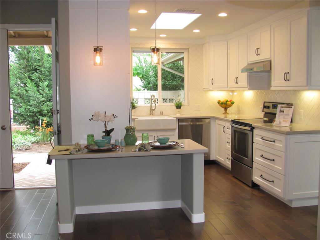I am proud to be representing one the most prominent builder/designers in our community with one of his own creations, and WOW!! He left it all out there with this truly amazing 2 bed 2 bath Granada model. The ambiance begins right away with the used brick set in a herringbone pattern for all the outside decking in the front patio, entry and atrium. Engineered wood flooring sets the tone for inside the residence. The kitchen is a chefs dream with a farm house style sink, unique, custom cabinetry and dramatic back splash tile soaring all the way to the ceiling. The counters are quartz and there is a built in work/computer station that blends seamlessly with the rest of the kitchen. The bathrooms in a word are beautiful. The floors are marble (stunning). The vanity tops match the kitchen quartz creating a great flow to the home. A lot of builders will simply "work around" the atrium - not this guy. It's actually the center piece. To go along with the used brick flooring he has built a wall of dark stained hard wood making for a warm, soothing vibe. Of course, there are washer dryer hook up in the home and skylights in the kitchen and living room.
Laguna Woods is a Senior Community located just few minutes' drive to famous Laguna Beach!