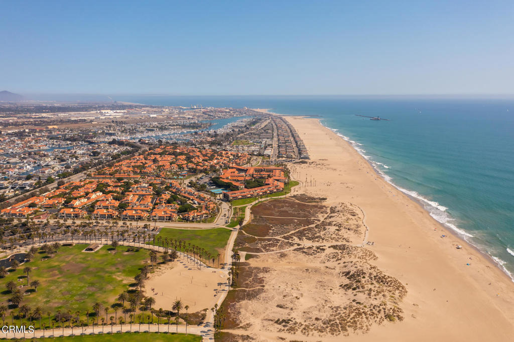Come enjoy the good life near the deep blue sea and all it has to offer with views of the four Channel Islands just a short walk from this condo at The Colony at Mandalay Beach. You will wake up daily to the cool ocean breezes and enjoy sunset walks all within a few minutes from this luxury condo's prime location. This home has it all with a rare oversized attached patio for entertaining your guests privately out doors and also the garage is attached to the patio so you can unload groceries with ease and have extra security!! This home is also in the quietest section away from street noise and super private. Live the life you love with this lovely two bedroom and 2 bathroom condo with recent updates throughout including, new interior paint, new carpet, newly refinished floors, a freshly painted cement patio and there is a newer furnace from 2020!! This wonderful home features two generous bedrooms including an oversized primary bedroom with en-suite bath with granite counter tops, a large walk in shower, and newly painted bathroom cabinets. Enjoy your light filled dining room and cooking in your updated kitchen with stainless steel appliances, a sensor faucet, granite countertops and freshly painted kitchen cabinets and enjoy the living room with your cozy fireplace on chilly beach evenings!! This luxury condo has interior laundry with washer dryer hook ups. So, hurry because this is a rare gem and a must see!! You can cruise to the islands by sailing or yachting and then join a fishing tournament right off the coast!! The community has two huge pools, 6 spas! There is also tennis courts, pickleball courts, racquetball, a fitness gym and library in the two clubhouses.