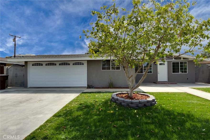 Totally Remodeled Home in a quiet neighborhood, featuring 4 Bed Rooms and 3 Baths, Enter the home with an open floor plan concept, large living room with high beam ceiling, the kitchen has been totally renovated with white shaker cabinets, quartz coffee counter top, oversize breakfast island for that perfect family gathering.  New 5 gas burning stove, new dishwasher, new contemporary hood, and plenty of storage space.  Bath rooms has been upgraded with new sink, and toilets.  All the bed room are sizeable with spacious closet.  Master bed room has a patio French door to gain access to the back yard, double sinks in the master bath, oversized shower stall with glass door and Italian tile, a walked in closet.  Engineered hard wood floor throughout the house.  Tank-less water heater, New AC. New paint interior and exterior, new garage door with a quiet belt technology opener.  Laundry hook up in the garage.  All new dual low E paned windows & sliding doors. Near Disneyland, Knott Berry Farm.  This home is a must see for all that discerning buyers.