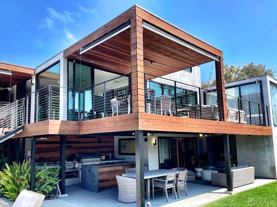 Nestled within the picturesque surroundings of La Jolla, this exquisite contemporary residence has undergone a meticulous remodeling, showcasing a remarkable fusion of concept and design. Set in complete seclusion, this property offers an intimate and sophisticated interior that emanates warmth and elegance. The expansive ceilings and floor-to-ceiling glass windows create a seamless connection to the surrounding greenery and breathtaking ocean views. Throughout the residence, beautiful oak hardwood engineering floors gracefully unite the spaces, while the carefully curated layout encompasses four spacious bedrooms, four and a half bathrooms, and an additional bonus game room. The gourmet Eggersmann kitchen stands as a culinary masterpiece, featuring top-of-the-line Miele appliances, including a refrigerator, and a stunning central eating island with a Wolf cooktop. The meticulous attention to detail extends to the Porcelanosa bathroom cabinets and Toto toilets, which add a touch of refined luxury. Abundant natural light fills the interior, complementing the open floor plan that effortlessly merges indoor and outdoor living, creating an idyllic environment for a truly remarkable lifestyle. Outside, a beautiful pool and spa are surrounded by manicured grassy areas, providing the perfect setting for entertaining guests and creating unforgettable memories. Undeniably exceptional, this one-of-a-kind property is an opportunity that should not be overlooked. From its thoughtfully designed interiors to its captivating outdoor spaces, this residence epitomizes luxury living at its finest. Experience the epitome of sophistication and seize the chance to own this extraordinary home.