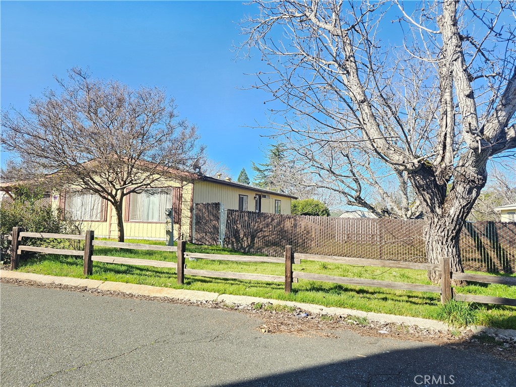 This cute, clean home in Orchard Shores includes two lots. It features an open floor plan with high ceilings, a great room, a den, a primary bed and bath, a guest bed and bath, and a laundry room. The galley-style kitchen has stainless steel GE appliances, a breakfast bar, dining area, and a large living room with high ceilings. The primary bedroom offers a large closet, linen closet, back-deck access, and a walk-in shower. The huge fenced yard includes a covered front patio, back deck, and side deck off the laundry. Don’t let this one slip by!