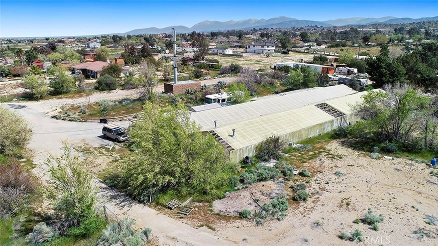 Amazing opportunity to own land with automatic income. Property has a Verizon cell tower located on it. Verizon pays you rent. Current rent is 1650 per month and will continue to increase each 5 year period. Currently in 2nd five year lease period. 2 flat acres with lots of parking. Has a greenhouse on it that is approx 9000 sq ft. Water and power are on site. Natural gas disconnected but available.  Zoned A-1. Many uses. Build a home. Horses. Commercial nursery? You name it the possibilities are endless. Fenced, paved road access. Approx 450' road frontage for maximum exposure. Come for a visit. Stay for a lifetime. Welcome Home!