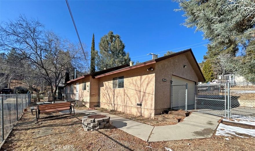 Great starter home, retirement home or investment property in scenic Lake Hughes. This 2 bedroom, 1 bath home has fully fenced yard and oversized 2 car garage. Living room has wood burning stove and attached bonus/patio room. Needs carpet and paint and upgrading. Lots of potential, priced for a quick sale! Escape from the city, discover the peaceful lifestyle of Lake Hughes just north of Santa Clarita.