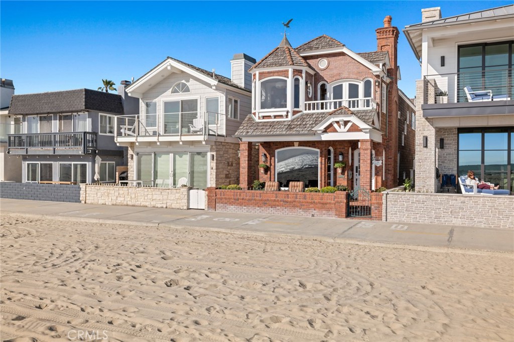 Welcome to 3006 West Oceanfront, sitting directly on the iconic boardwalk of Newport Beach and within very close proximity to Pacific Coast Highway allowing for easy access. Award winning builder, Tony Valentine, worked alongside award winning architect, Brian Jeannet, to create this exquisite home offering an unparalleled coastal living experience with panoramic ocean views from every look out. Additionally, a team of master carpenters spent two years selecting custom white oak to complete the woodwork specifically run for the interior of the home. Encompassing 3 bedrooms, a den, and 3.5 bathrooms; this residence is flooded with natural light from expansive windows and skylights and graced with vaulted ceilings. On the first level you are greeted by the spacious living room, kitchen, and den. On the second level you can find two comfortably sized guest rooms with a jack and Jill bathroom; the upstairs is completed by the master bedroom retreat which is a sanctuary of luxury, featuring his and hers closets and bathrooms, a balcony, and a sitting area where one can revel in the unobstructed ocean view. Outside, a charming front patio provides the perfect spot for sun-soaked relaxation or al fresco dining. To add to the functionality of the home, the attached two car garage can be reached by three different access points - making parking a breeze! With its coveted location and captivating features, this coastal retreat epitomizes the allure of Newport Beach living. Its proximity to world-class dining and shopping destinations like Lido Marina Village ensures that every indulgence is just a leisurely stroll away.