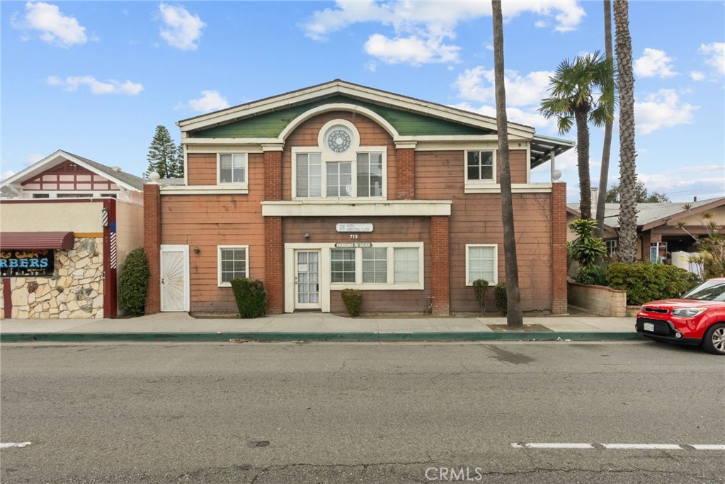 A standout property with undeniable curb appeal, this rare mixed-use gem is situated in the heart of the Anaheim Downtown Historic District. Perfectly blending business potential with modern living, this property offers nearly 1,400 square feet of prime retail space on high-traffic Anaheim Blvd—an entrepreneur’s dream for visibility and accessibility. Its unbeatable location, just minutes from Disneyland and Angel Stadium, ensures a steady flow of foot traffic, making it an ideal setting for any thriving business.
Above, a beautifully designed 3-bedroom, 2-bathroom residence spans an additional 1,400 square feet, featuring high ceilings, abundant natural light, and thoughtful details that create a warm and inviting atmosphere. Step onto the front porch balcony to take in the charming historic surroundings, or unwind on the private rear balcony for a peaceful retreat.
Adding to its exceptional value, the property includes a spacious two-car garage and an expansive rear parking lot with space for up to 10 vehicles—offering both convenience and potential for future development. Move-in ready and meticulously maintained, this is more than just a property—it’s an opportunity to integrate your home and business seamlessly in one of Anaheim’s most sought-after locations. Whether you're an investor, entrepreneur, or homeowner looking for a vibrant live-work space, this property offers endless possibilities in a prime, high-traffic area.