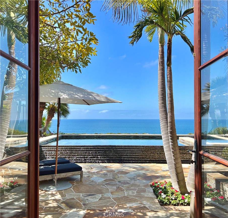 Available Short-Term and Seasonally. Among the finest properties along the California Riviera, this gorgeous estate is situated behind the secure and exclusive guard-fronted gates of Crystal Cove. This front-row property is a view lover’s dream enjoying peerless, forever views with famed Crystal Cove State park lining the horizon and giving way to endless sunset and white water vistas. You can easily access the award-winning shops, restaurants, and amenities of the shopping plaza below the community, as well as miles-long trails, beaches, and the best-in-class golf courses nearby. The open floor plan of this custom-designed home is perfect as it invites ocean views from the living areas, kitchen, and first-level primary bedroom. Additionally, the thoughtful outdoor spaces offer a perfect place for relaxation and entertainment. The property also provides one detached guest room that offer privacy and comfort for visiting guests. This property is ideally located between Corona Del Mar and Laguna Beach, and just a short drive from John Wayne Airport, making it the perfect place to experience everything that Orange County has to offer.