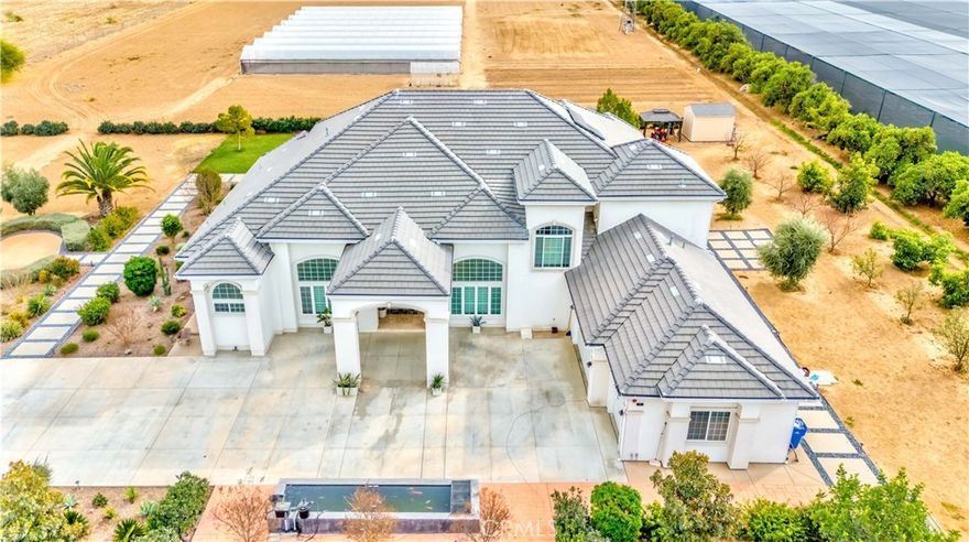 Wow! Huge price deduction. This exceptional custom-built home, nestled on a sprawling 5-acre lot, offers the perfect blend of luxury, privacy, and functionality. Located behind a gated front entry, this 5-bedroom, 6-bath estate features 6,500 square feet of living space, 3 bedrooms first floor including Master bedroom and 4 full bathroom, Office/bonus room could be another bedroom, 2nd floor you have huge bonus room and two bedrooms (you could use one of bedroom for second master bedroom) each bedrooms have own bathrooms and walk-in closet, providing ample room for both relaxation and entertainment. Built in 2015, the home is designed with impeccable craftsmanship and attention to detail.

You must see the green houses!



The grand formal living and dining areas boast soaring cathedral ceilings, creating a sense of openness and elegance. The chef’s kitchen is a culinary dream, featuring Quarts countertops for both kitchen and bathrooms, a large island, and top-of-the-line appliances. It seamlessly flows into a cozy breakfast nook and a spacious family room, ideal for both casual gatherings and formal occasions.



The luxurious master suite serves as a true retreat, complete with a walk-in closet and a spa-like private bath. Hardwood floors throughout the home add warmth and sophistication, while the thoughtful design ensures both comfort and style.



Outside, the property is a private oasis with 11 water stocks, a greenhouse, 40 mature orange trees, and 60 additional fruit trees, perfect for those who enjoy gardening or simply desire a serene natural environment. The 3-car garage provides ample parking, while the expansive lot allows for plenty of additional space. Whether you’re looking to entertain or unwind, this home offers unparalleled luxury and privacy in a beautiful setting.

Two set of solar , Koi pond .... 8 huge green houses..... two private decks from bedrooms..... too many things to mention