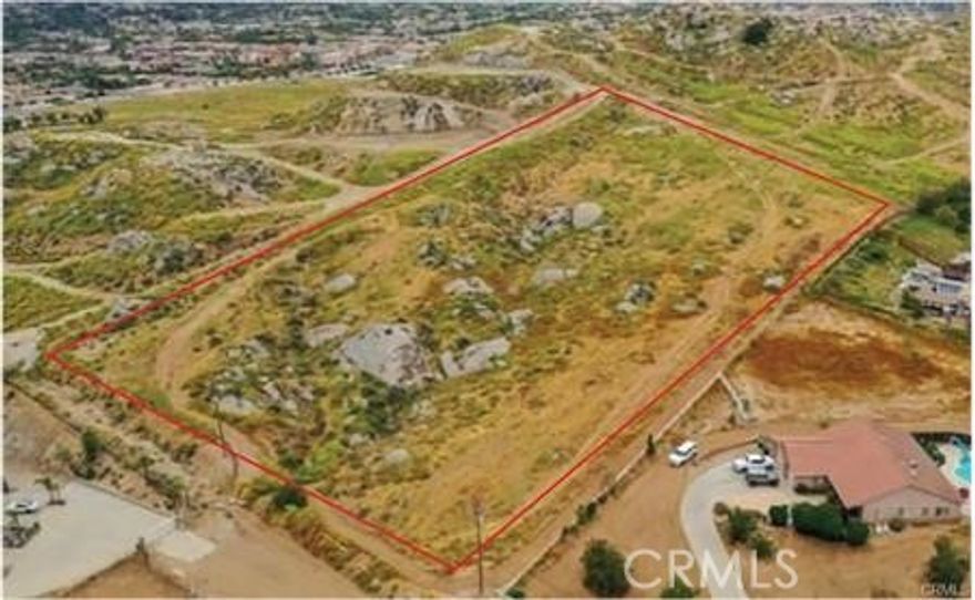 Elevated view lot in Woodcrest surrounded by custom homes.  Prime Location! Space for multiple building pads, each with panoramic views.