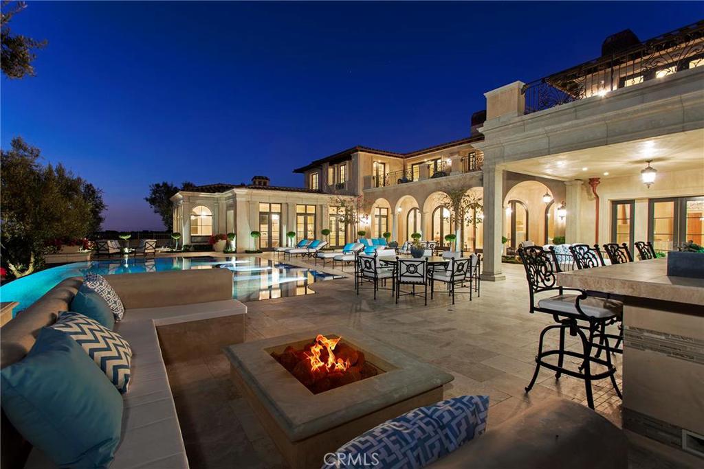 Breathtaking vistas of sea & sky abound from this coveted corner lot situated in renowned Pelican Crest. After extensive renovation, this elegant estate dramatically showcases a level of quality & detail beyond compare. A unique 35-ft building height allowance provides for soaring ceilings & volume. Large social rooms are adorned with fine moldings, sparkling chandeliers & hand-carve stone fireplaces, accentuated by beautiful marble flooring. The gourmet kitchen & adjacent caterer's kitchen graciously extend to the family room, creating a casually elegant environment. The master bedroom features a large viewing terrace, exercise room & spa-like bath. The generously proportioned secondary bedrooms are equally noteworthy. Indoor amenities include pool/spa, sauna, theater & climate-controlled wine room. Outdoors, enjoy a covered loggia with fireplace, BBQ, fire pit & a saltwater pool/spa. Additional highlights include whole-house a/v and security system, library, 8-car subterranean garage and a gated motor court with parking for 4 cars. Experience the world class Newport Coast lifestyle with close proximity to famed Pelican Hill Resort and Golf Course, beaches of Crystal Cove State Park, shopping and dining at Fashion Island, and John Wayne Airport and LAX.