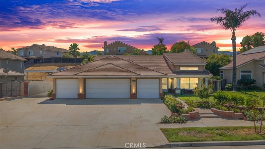 Welcome to this stunning single-story pool home, with a 4 car garage and RV parking, this is a rare gem! Soaring 13-foot cathedral ceilings, open floor plan and large windows add tons of natural light, creating a bright, airy feeling. A gas fireplace with a custom built-in shelf creates a cozy focal point, and custom dimmable lighting allows you to set the perfect mood. An accordion doors leads directly to the beautifully landscaped backyard, bringing the outdoors in. One guest bedroom, located just off the living room, can easily serve as either a bedroom or a home office. Featuring new luxury vinyl tile flooring, while the bedrooms are have plush new carpeting. The kitchen is gorgeous, truly a chef’s kitchen. With custom cabinetry, quartz countertops, an expansive island, with bar seating and elegant wood side paneling, it is perfect for gatherings. Featuring high-end black stainless steel appliances, including a drawer microwave. Includes thoughtful features like a built-in trash drawer, a custom Lazy Susan, a wine/coffee nook, and soft-close drawers and cabinets. Under-cabinet lighting adds a stylish touch, and the large pantry offers storage with soft-close drawers. Off the large primary suite, the bathroom features custom cabinetry, a luxurious new shower with dual showerheads, a rain shower, and a built-in bench. A modern barn door leads to the bathroom, and new closet doors provide an updated look. Premium finishes and soft-close cabinetry can be found in all bathrooms. The two remaining bedrooms, are spacious and have new ceiling fans. The laundry room is spacious featuring a large sink. The backyard is an outdoor oasis. Featuring a new Alumawood patio cover with ceiling fans, lights, and outlets. New landscaping, complete with mature trees, efficient irrigation, drains, and hardscaping, ensures easy maintenance. A gas hookup is ready for your grill. There’s also large RV parking with a RV plug, perfect for your recreational vehicles. On the side of the house, you'll find a charming second gazebo. The four-car garage is a standout feature, featuring epoxy flooring. The paid-off solar offers energy savings and potential refunds from SCE. With no HOA and low taxes, this home offers $250,000 worth of premium upgrades. Located in a phenomenal school district. The 91, 15 freeways and Foothill Expressway are minutes away. This home has everything you’re looking for and is truly a rare gem in Corona. Schedule a private showing today!