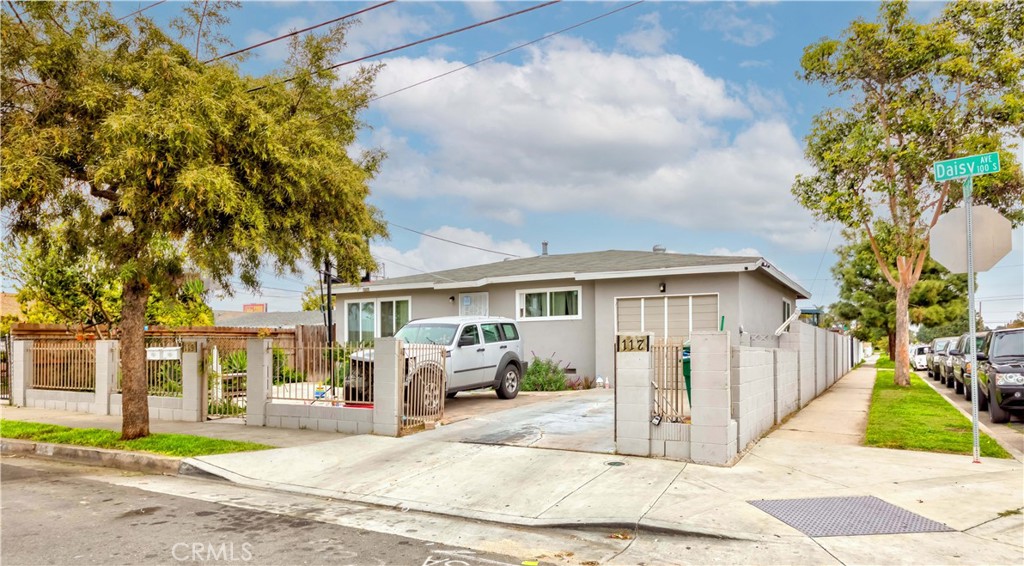 Incredible Investment Opportunity in the Highly Desirable City of Santa Ana – Two Homes on One Corner Lot! Located on a prime corner lot, this property offers fantastic curb appeal and a wealth of potential! With two homes on a spacious lot, it’s the perfect opportunity for investors, homeowners seeking rental income, or those in need of multigenerational living options. The Main Home boasts 3 generous bedrooms, 2 bathrooms, and a kitchen with elegant granite countertops, abundant cabinet space, and a convenient pantry. The open floor plan seamlessly connects the living and dining areas to the remodeled kitchen, creating a welcoming atmosphere for family gatherings. Additionally, the attached 1-car garage offers direct access, while the gated driveway provides plenty of parking. The low-maintenance yard is ideal for hosting family and friends, making it a perfect space for relaxation and entertainment. The Second Home has been thoughtfully remodeled, featuring a modern kitchen with granite countertops, ample cabinetry, and a dining nook. The remodeled bathroom is equipped with a luxurious rain shower, and the living room’s high ceilings create an open and airy feel. Both bedrooms include mirrored closet doors, adding a touch of elegance and practicality. Each home has its own private entrance, ensuring privacy and comfort for all residents. The spacious yards provide ample room for relaxation, entertainment, and outdoor enjoyment. Prime Location: This property is centrally located near Santa Ana College, CHOC Children’s Hospital, parks, grocery stores, dining, and entertainment options. Commuters will appreciate the easy access to major freeways, including the 5, 22, 55, 57, and 405. The property is in great condition, with each unit having separate electric and gas meters. The current landlord covers water and trash, and there are fantastic tenants who are interested in extending their leases. With the potential for high returns, this is an investment you don’t want to miss. Don’t wait on this rare opportunity to own two homes on one lot in a prime location. Act now this property won’t last long!