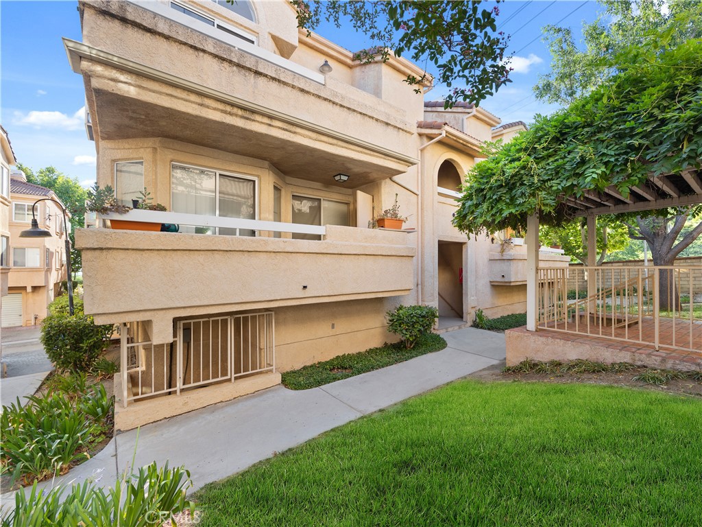 Priced to sell! Welcome to this charming condo nestled in the heart of Newhall, CA. This cozy yet spacious residence boasts 1,078 square feet of living space, featuring 3 bedrooms, 2 bathrooms, and a loft, providing ample room for comfortable living. The floor layout creates a seamless flow between the living and kitchen area, perfect for entertaining guests or relaxing with family. The kitchen is equipped with plenty of cabinet space. Natural light floods the interior, creating a warm and inviting atmosphere throughout the home. The primary bedroom offers a peaceful, while the additional bedrooms are nicely sized and ideal for family members or guests. The loft area provides versatility and can be used as a home office, playroom, or additional living space to suit your needs. Outside, residents can enjoy the community amenities, including a pool, spa, and gated access. Don't miss out on the opportunity to make this lovely condo your new home. Schedule a showing today!