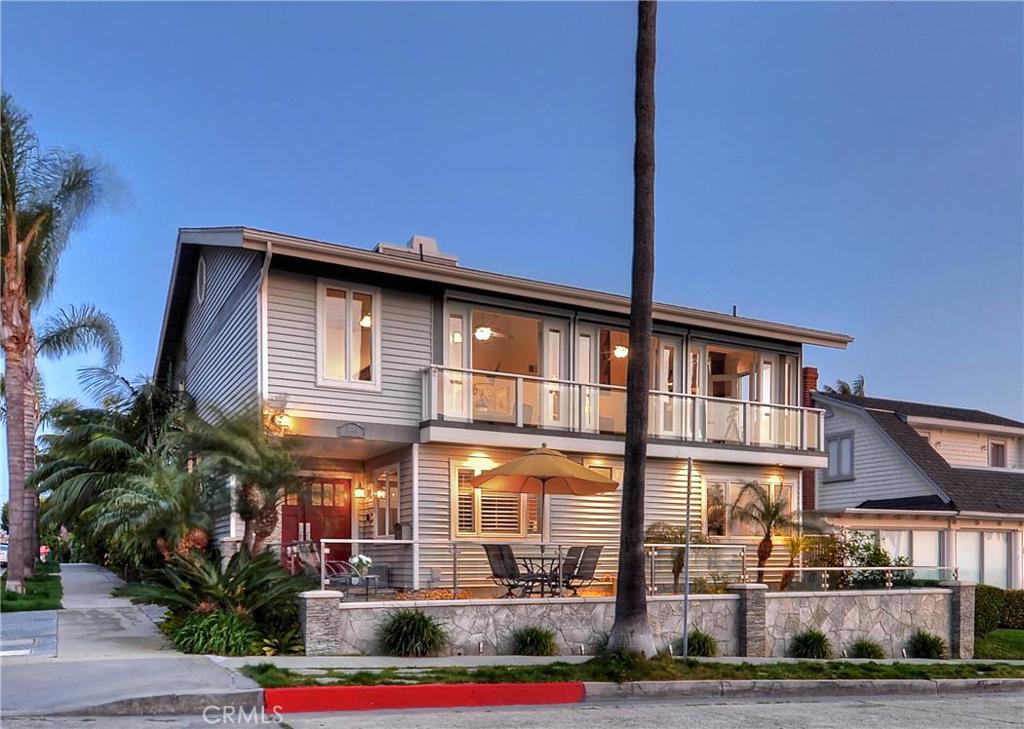 Magical panoramic ocean views are only the beginning at this ideally located custom residence with a 45'-wide homesite south of PCH in Corona del Mar. Watch sailboats and yachts glide in and out of the harbor as the sun sets over Catalina Island, giving way to twinkling city lights up and down the coast. Enjoy a picnic just down the street at a bluff-top park, or walk down the hill to Big Corona Beach. Village shops and restaurants are all close to home, award-winning schools serve the neighborhood, and Newport Beach’s world-renowned Fashion Island is mere moments up PCH. At home, most rooms are enhanced by ocean views, along with an inviting front lanai, upstairs deck and a rooftop patio with mesmerizing 360-degree views. If you’re a car enthusiast, the view inside the 6-car garage is amazing, too. Enjoy an epoxy-finished showplace for your prized autos, complete with extensive built-in storage. Featuring 3 bedrooms plus office and 3.5 baths in approx. 4,500 s.f., the 2-level design displays an abundance of French doors and windows, an open living and dining room with circular fireplace, a remodeled kitchen, a catering kitchen, bonus room, office, pub-style bar, a fireplace-warmed courtyard, and ocean-view master suite with remodeled spa-inspired bath.