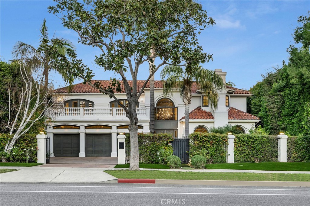 A rare find in the heart of Beverly Hills and meticulously renovated in 2014, this move-in-ready estate in The Flats seamlessly merges comfort with unparalleled design, creating an extraordinary contemporary retreat. The grand two-story foyer sets the tone for the interior, featuring formal and informal living areas with gas fireplaces, a modern open workspace, ground-level fifth bedroom and en suite. Every detail has been carefully considered, including a three-car garage equipped with an electric vehicle charging station, an in-home elevator, central vacuum, state-of-the-art security system, and a comprehensive water filtration system that services the entire residence. The heart of the home is the gourmet kitchen, adorned with elegant finishes such as Caesarstone counters, an expansive waterfall-edge island, and wall-to-wall imported lacquered cabinets. No expense was spared in the upgraded appliance and accessories package, which includes top-of-the-line Sub-Zero, Miele, Wolf, and Gaggenau appliances, fulfilling every culinary enthusiast’s dream. Ascending to the upper level, discover a luxurious haven with four bedrooms, each boasting en suite bathrooms, walk-in closets, direct access to a spacious terrace, and automated blackout shades. The primary suite stands out with its comfortable sitting area, a 55-inch Bang & Olufsen TV on a motorized articulating wall mount, built-in shelves and desks, and dual walk-in closets. The primary bathroom is a lavish retreat, offering an oversized glass steam shower, soaking tub, his and her toilet rooms, and double vanities. Outside, the grounds create a serene oasis with meticulously landscaped gardens, a koi pond, and an outdoor barbecue kitchen. The patio area is perfect for al fresco dining, while the sparkling pool and spa provide a refreshing escape from the California sunshine. This exceptional property offers a private sanctuary with convenient access to Beverly Hills' finest amenities and exquisite dining options.
