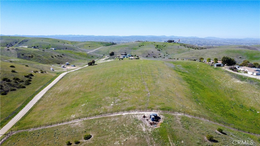 Nestled atop a picturesque 10-acre parcel in rural Paso Robles, this property offers 360-degree panoramic views, tranquility, and a serene lifestyle. Ideally located just minutes from the renowned wineries of Paso Robles, charming downtown Paso Robles and Atascadero, and only a 35-minute scenic drive to the stunning California coastline, this property is perfectly positioned for enjoying the best of Central Coast living.
With a long, level ridgeline and gentle slopes toward the road, the land offers versatile building opportunities, making it ideal for your custom home, retreat, or other improvements. A conveniently placed power pole on the corner and mid-roadside ensures easy access to electricity, further adding to the lot’s potential. Whether you’re envisioning a private estate, vineyard, or a peaceful getaway, this property is ready to bring your dream home to life.