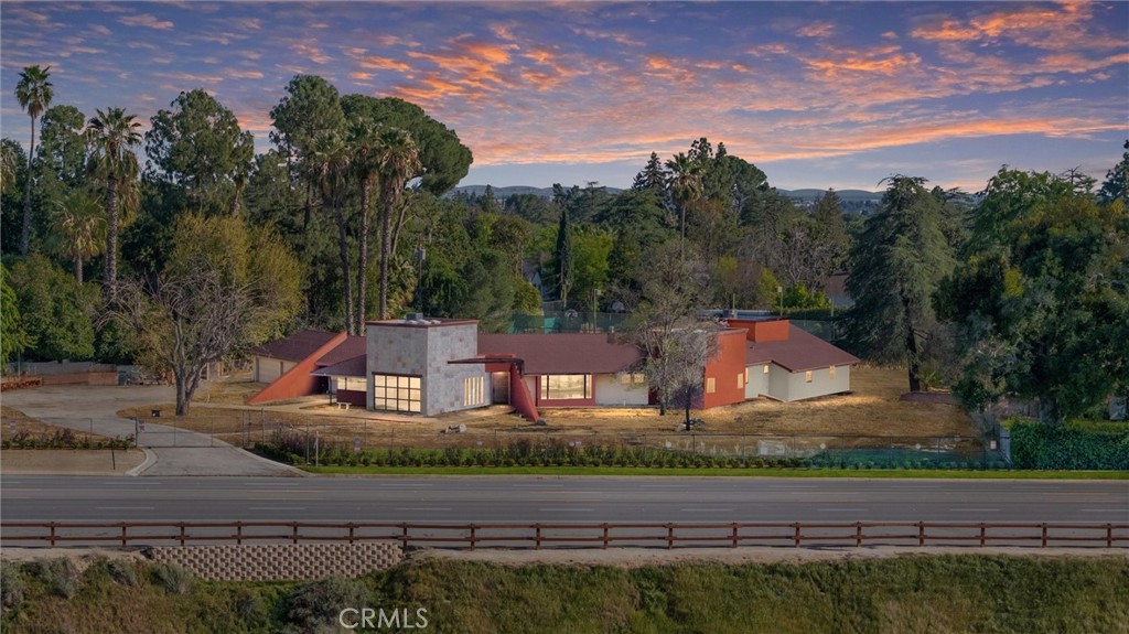 Nestled in the prestigious Cresta neighborhood, this stunning estate offers a perfect blend of elegance, luxury, and functionality. Situated on a 1.5-acre lot, this 6,760 sq. ft. masterpiece boasts five en-suite bedrooms and five and a half bathrooms. Step inside to discover sophisticated formal living and dining areas adorned with porcelain flooring and an exquisite lighting package. The modern chef's kitchen is a culinary dream, featuring stainless steel appliances, quartz countertops, a double oven, and ample storage. With its impeccable design and top-tier finishes, this home redefines upscale living. All spacious bedrooms in this prestigious estate are en suite, featuring Jacuzzis and walk-in closets. The property also boasts a thoughtfully designed basement, complete with a wine cava, a movie theater, and additional entertainment space. Additionally, there is an extra bedroom and bathroom separate from the main house, which can also serve as a private office.