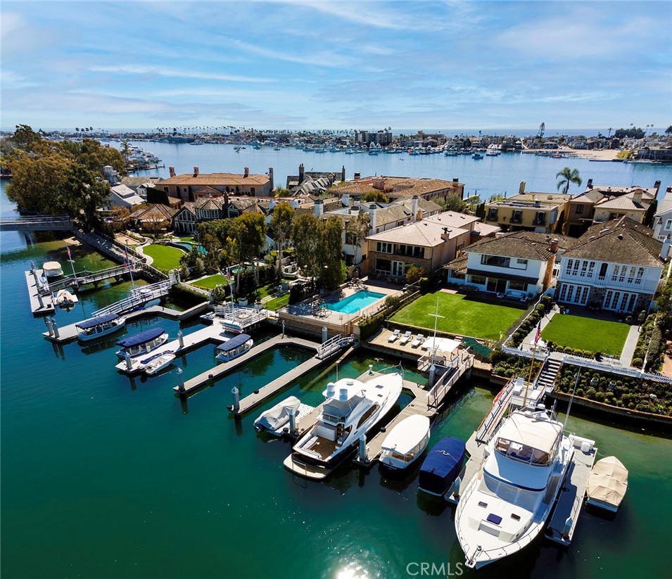 Welcome to the most exclusive and coveted island community in Southern California. Escape the mundane at your personal oasis, 11 Harbor Island, featuring 50’ of water frontage, a private boat slip for up to a 57’ yacht, and stunning coastal views. Enjoy your mornings taking in the tranquility of calm waters reflecting their surroundings as if Monet himself had brushed the water’s surface. Relax as the glow of evening’s sunsets gives way to sparkling city lights. Truly a rarity in bay front living, the home features an expansive lawn and beach. Appreciate the immaculate 3 bedroom, 3 bathroom home or create your one-of-a-kind vision. Ideally situated with views down the channel, the leeward side of the island offers protection from the elements and a privacy unparalleled in any other location in the harbor. A once in a lifetime opportunity to live the dream.