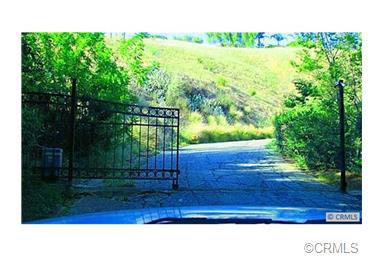 Super lot in a private community with gated access. Corner lot on a hillside. it is literally on the corner of G street and Litras. To your right as you enter the private gate. Perfect hide away for the weekends, second home or? On a private street with private gateway. Custom built homes nearby and throughout community. not much of a slope to deal with, so the grading costs should be minimal.