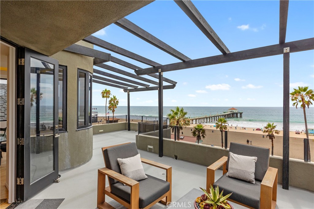 Spectacular Strand townhouse, True panoramic ocean views from most rooms. This townhome is located one block north of the pier on a prime strand corner lot in downtown Manhattan Beach. The property consist of two large bedrooms and two baths, all on one level. Open kitchen and living room with sweeping ocean and pier views. Large primary suite with ocean views, walk-in closet and a spacious master bath. The second bedroom is also extra large with its own walk-in closet. The living room opens up to a good sized ocean view deck (apx 394 sqft) great for visiting with family and friends. There are lots of possibilities with this unique space. This property is a must see!